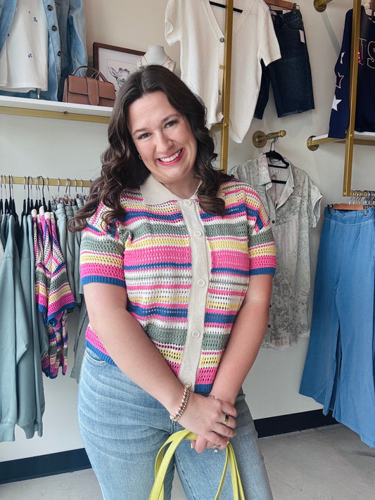 Sunday Edition

Brighten your wardrobe with this vibrant multi-stripe crochet button-up, featuring a classic polo collar and breezy short sleeves. This lightweight knit combines retro charm with modern comfort, making it the ultimate transitional layer for any season.

Vibrant multi-color stripes pop beautifully.
Breezy, lightweight open-knit texture.
Classic polo collar adds sophistication.
Effortless button-up versatility.
Soft, high-quality crochet knit.
Perfect for layering or solo wear.
Trendy vintage-