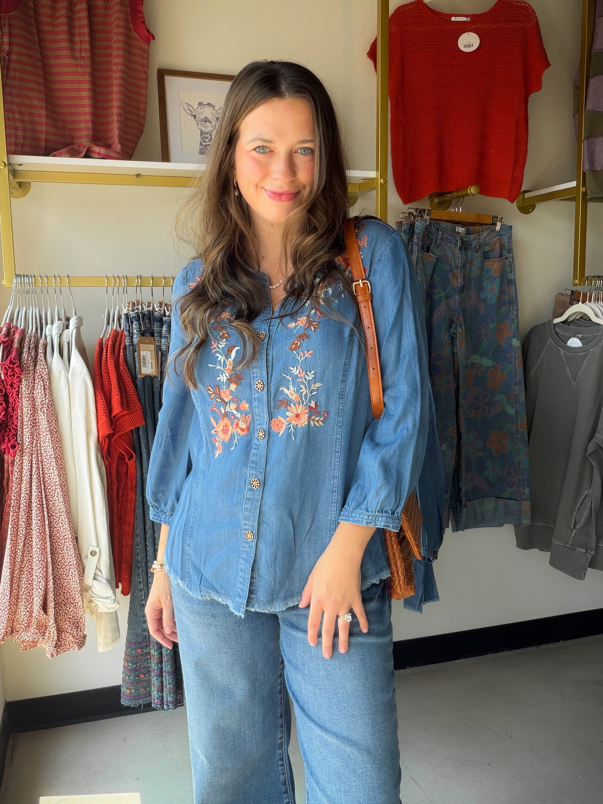 Boho-chic meets artisan craftsmanship. The V Neck Embroidered Fringe Top features rich embroidery and a playful fringe hem that give it a one-of-a-kind, handcrafted feel. A band collar, 3/4 sleeves, and button-front silhouette keep it polished, while the soft Lyocell fabric drapes effortlessly for all-day comfort.

Band collar with button-front closure
3/4 sleeve length
Rich embroidery and fringe hem detail
Soft, flowing Lyocell fabric
Available in sizes S–1X