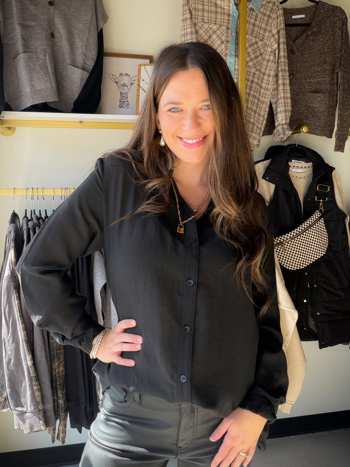 A classic black button-up with a hint of intrigue. The semi-sheer look makes this Mustard Seed top an easy way to add dimension to an outfit. Layer it over a cami for daytime plans or style it with tailored pants for an evening out.

