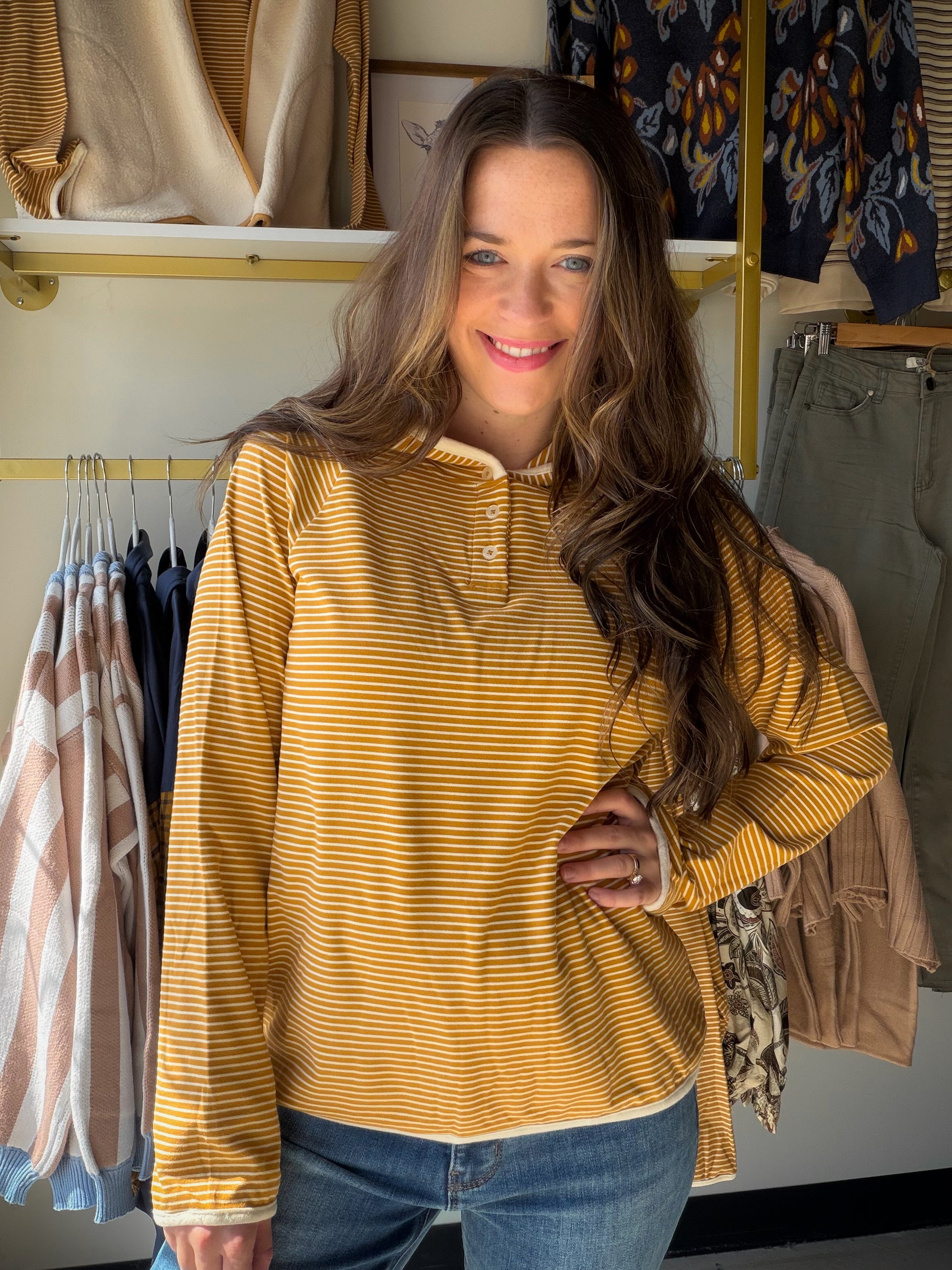 Casual comfort with a boutique finish. The&nbsp;Mustard Stripe Button Hoodie by Staccato is the hoodie upgrade your wardrobe deserves — a micro brushed stripe knit in warm mustard with color-trimmed detailing and a button neckline that takes it from basic to intentional. Long sleeves, cozy hand feel, and an easy silhouette that layers effortlessly over everything.

Why You'll Love It

Micro brushed stripe design — subtle texture with a soft, cozy finish
Color-trimmed detailing — the elevated touch that sets