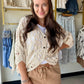 The layer you didn't know you needed. The Natural Batwing Crochet Cardigan brings that effortless, throw-it-on energy with a relaxed batwing silhouette and delicate crochet craftsmanship that feels anything but casual.

A V-neckline and button-down front keep it versatile — wear it open as a breezy layer over your favorite summer dress, or buttoned up as a standalone top. The high-low hem adds a modern touch, and the airy cotton-blend crochet makes it the kind of piece you'll reach for on repeat all season 