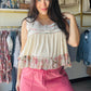 POL

Indulge in the buttery-soft feel of POL’s signature jersey fabric. This feminine natural floral babydoll tank pairs a modern square neckline with flirty floral trim for an effortless, boho-chic look. Lightweight and cropped, it’s the ultimate fusion of comfort and high-end style• Signature ultra-soft POL jersey fabric.

• Flattering square neckline and sleeveless cut.
• Feminine floral trim and ruffle hem.
• Breathable, lightweight comfort for all-day wear.
• Modern cropped fit for easy styling.
• Dura