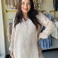 Breathable double gauze fabric brings comfort and style to this natural floral woven top. The 3/4 sleeves feature convenient roll-tab closures, allowing you to adjust the fit throughout the day. Its lightweight, airy construction makes it an excellent choice for layering or wearing on its own during warm weather. The subtle botanical print complements any casual wardrobe, whether you're heading to brunch, the office, or weekend adventures. Versatile, comfortable, and effortlessly chic.