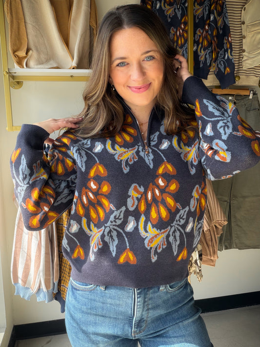 Casual cool, fully refined. The&nbsp;Navy Printed Half Zip Popover by Rain &amp; Rose takes the laid-back ease of a pullover and gives it a polished edge — a printed navy design with a half-zip neckline that adds just enough detail to make it a standout. Soft, drapey fabric that feels luxurious on and looks intentional every time.

Why You'll Love It

Navy printed design — rich, versatile, and effortlessly elevated
Half-zip neckline — a functional detail that adds a sporty-chic finish
Popover silhouette — r