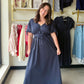 Gigio

Turn heads in this breathtaking navy maxi featuring romantic 3D floral appliqué details and a graceful V-neckline. Designed with adjustable drawstring shoulders and a feminine tie-back, it offers a custom, flowy silhouette that radiates effortless elegance.

Stunning 3D floral appliqué waist detail.
Adjustable shoulders for a custom fit.
Elegant tie-back adds romantic flair.
Smocked back waist flatters every curve.
Fully lined skirt for premium comfort.
Deep V-neckline lengthens your silhouette.
Brea
