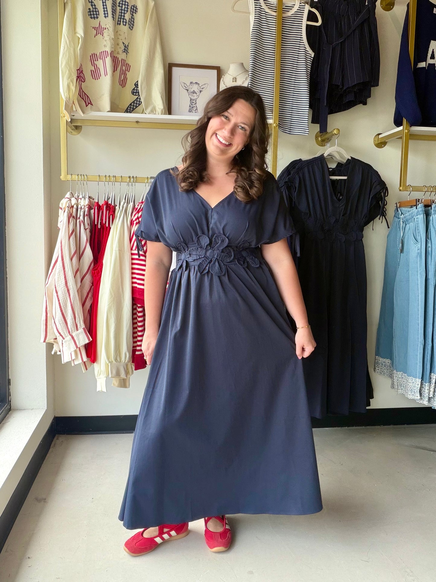 Gigio

Turn heads in this breathtaking navy maxi featuring romantic 3D floral appliqué details and a graceful V-neckline. Designed with adjustable drawstring shoulders and a feminine tie-back, it offers a custom, flowy silhouette that radiates effortless elegance.

Stunning 3D floral appliqué waist detail.
Adjustable shoulders for a custom fit.
Elegant tie-back adds romantic flair.
Smocked back waist flatters every curve.
Fully lined skirt for premium comfort.
Deep V-neckline lengthens your silhouette.
Brea