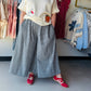 Easel

Elevate your everyday style with these breezy, wide-leg cotton pants featuring a timeless navy gingham print. Effortlessly chic and designed with functional pockets, they offer the perfect blend of breathable boho comfort and classic charm

Breathable 100% premium cotton fabric.
Functional pockets for your essentials.
Flattering, ultra-flowy wide-leg silhouette.
Comfortable elastic waistband for ease.
Timeless navy and white gingham.
Effortless boho-chic style by Easel.
