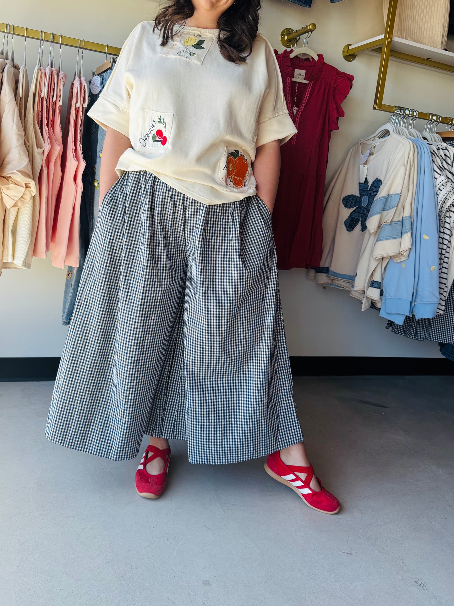 Easel

Elevate your everyday style with these breezy, wide-leg cotton pants featuring a timeless navy gingham print. Effortlessly chic and designed with functional pockets, they offer the perfect blend of breathable boho comfort and classic charm

Breathable 100% premium cotton fabric.
Functional pockets for your essentials.
Flattering, ultra-flowy wide-leg silhouette.
Comfortable elastic waistband for ease.
Timeless navy and white gingham.
Effortless boho-chic style by Easel.

