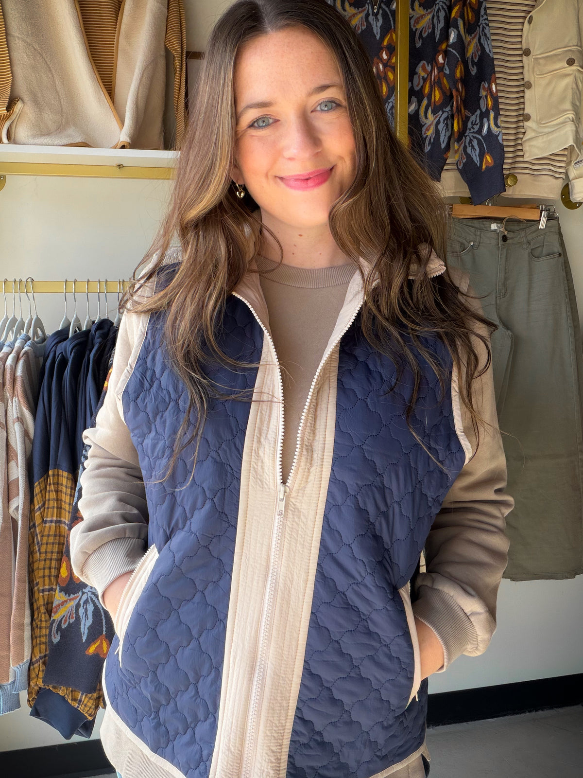 Layer up in style. The&nbsp;Navy Mixed Quilted Vest by Doe &amp; Rae is a versatile outerwear essential that brings warmth and texture together effortlessly. A mixed quilted pattern creates visual depth, while a high neck design and neutral contrast trim along the zipper, shoulders, and pockets give it a modern, polished edge. Zip it over a turtleneck or a cozy long-sleeve — this vest does the heavy lifting.

Why You'll Love It

Mixed quilted pattern — unique texture that stands out from the standard puffer