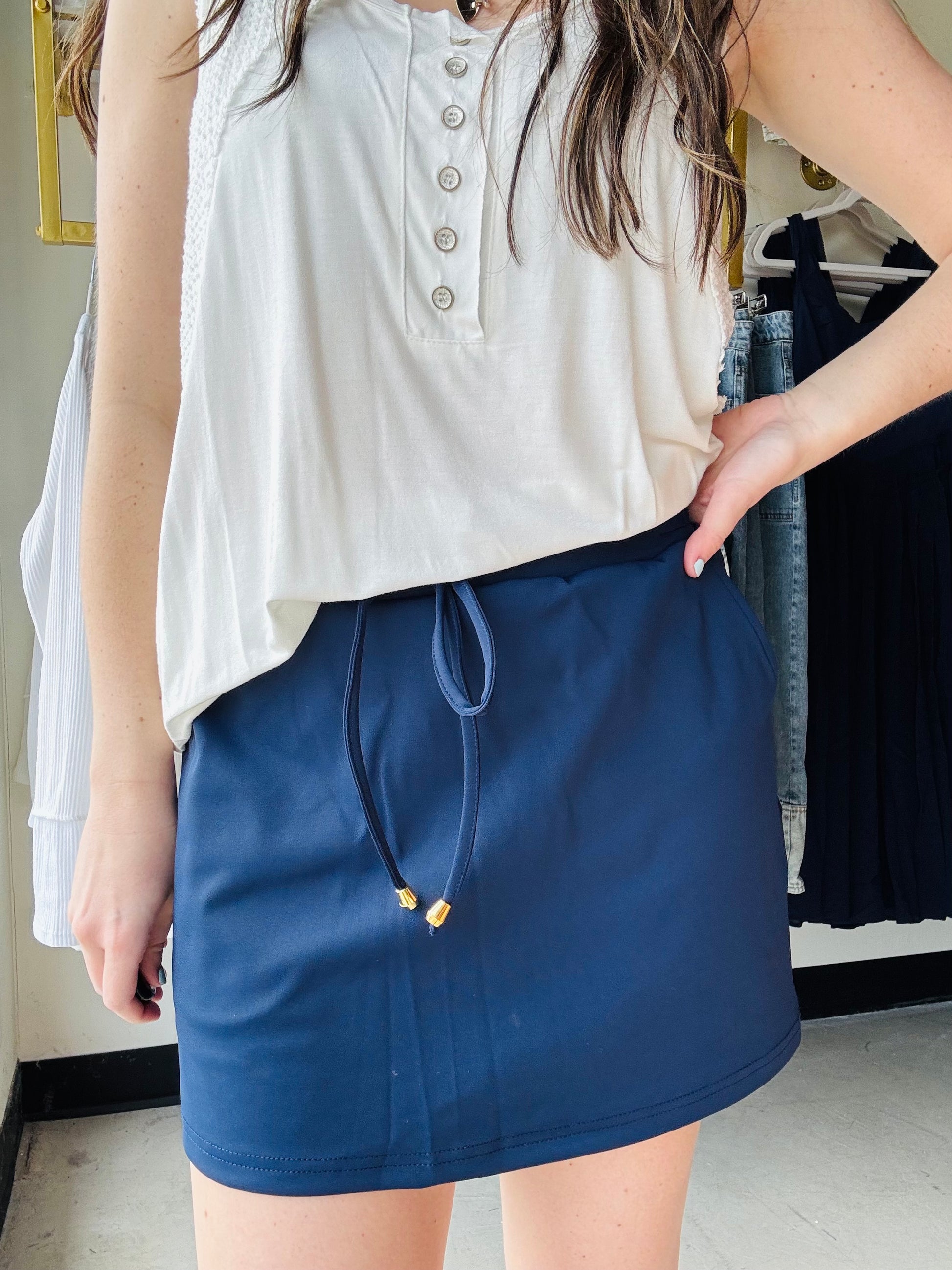 Be ready to take on your daily adventures in style with this skort! The elastic band on the back provides a customized fit, while the built-in shorts allow you to move freely without worrying about what's underneath. Plus, with side pockets and a drawstring tie, you can live your best life with a casual, athletic look that's too good to pass up. So, go ahead and grab yours before it's all gone!