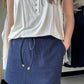 Be ready to take on your daily adventures in style with this skort! The elastic band on the back provides a customized fit, while the built-in shorts allow you to move freely without worrying about what's underneath. Plus, with side pockets and a drawstring tie, you can live your best life with a casual, athletic look that's too good to pass up. So, go ahead and grab yours before it's all gone!