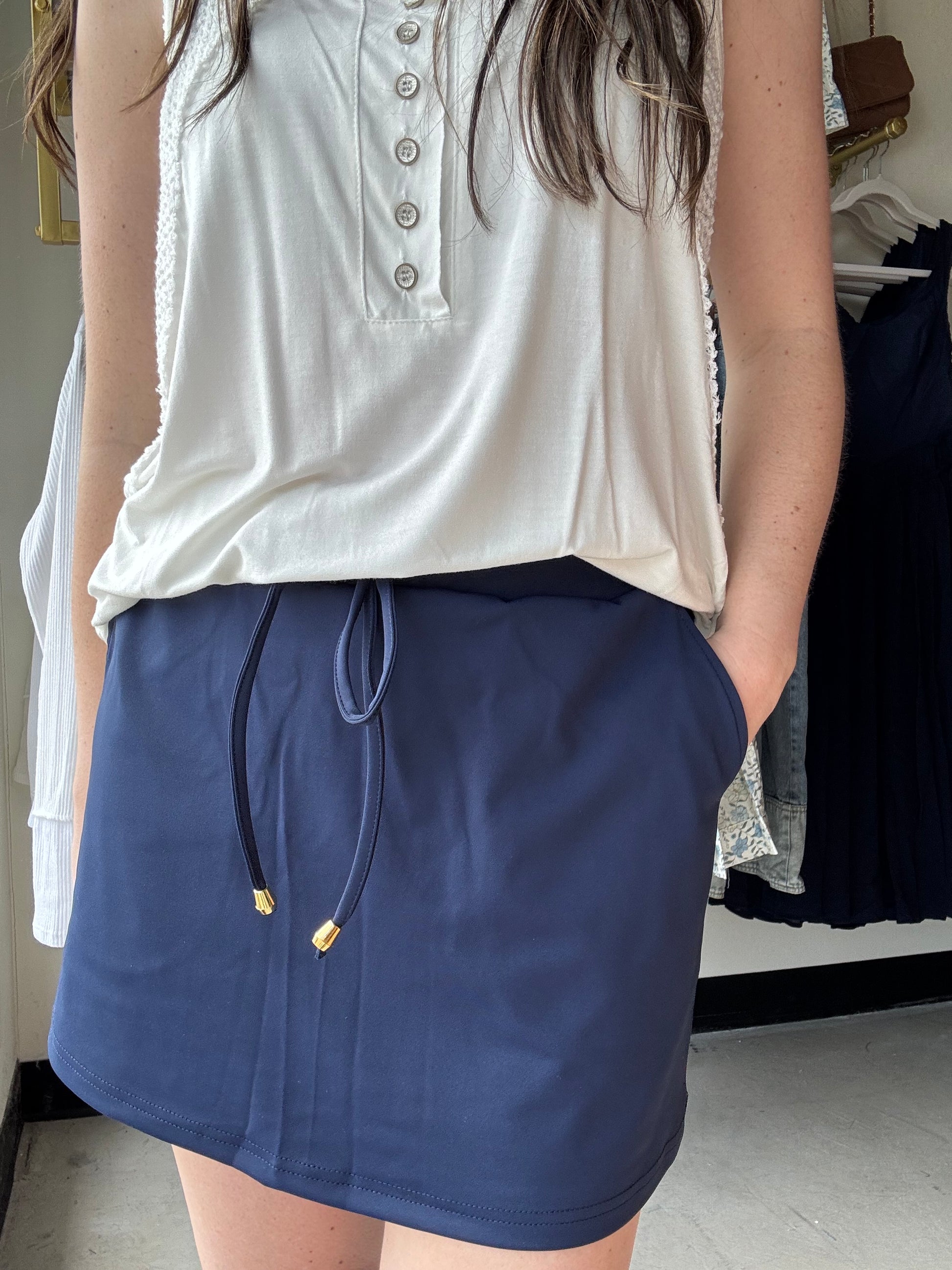 Be ready to take on your daily adventures in style with this skort! The elastic band on the back provides a customized fit, while the built-in shorts allow you to move freely without worrying about what's underneath. Plus, with side pockets and a drawstring tie, you can live your best life with a casual, athletic look that's too good to pass up. So, go ahead and grab yours before it's all gone!