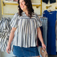 Haptics

Elevate your everyday style with this breezy, nautical-inspired essential. Featuring chic bubble sleeves and a delicate ruffle neckline, this lightweight blouse offers the perfect blend of effortless comfort and preppy sophistication

Playful bubble sleeves add trendy volume.
Breathable fabric for all-day comfort.
Flattering ruffle-trim slit neckline.
Timeless navy stripes for coastal vibes.
Easy fit pairs perfectly with denim.
Lightweight feel, high-impact style.