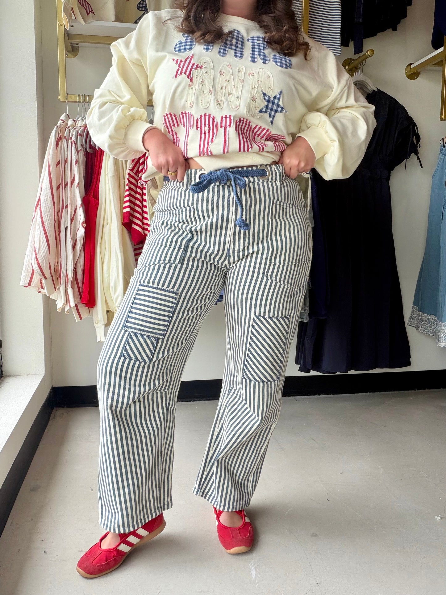 Bibi

These versatile barrel pants feature a classic navy and white stripe pattern in durable twill fabric. The relaxed, tapered silhouette offers modern comfort with an adjustable drawstring waistband for a customized fit. Perfect for casual outings or dressed-up occasions, these pants transition seamlessly from day to night. The striped design adds visual interest while remaining easy to style with your favorite tops and accessories.
