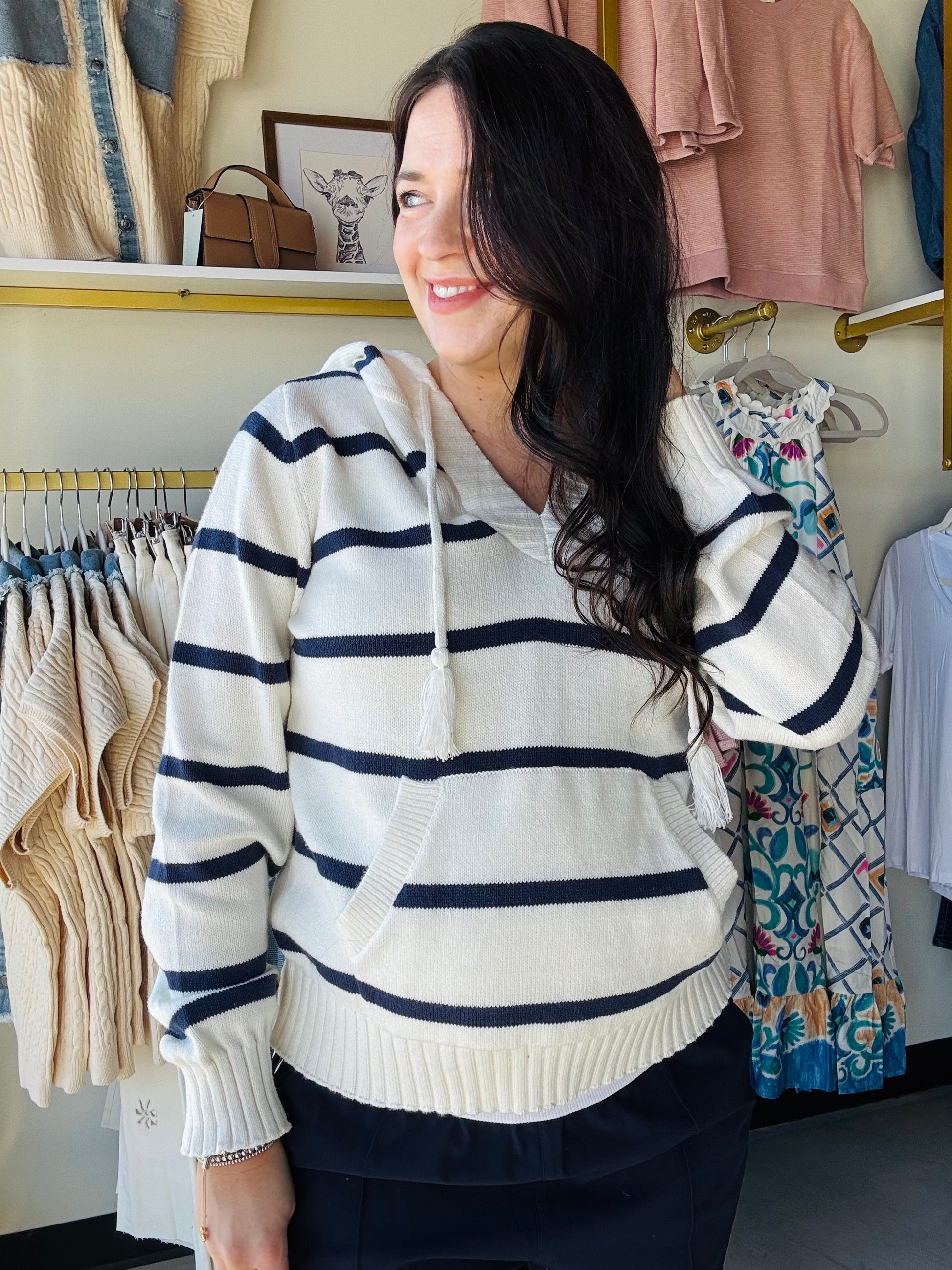 Thread &amp; Supply

Just as effortless as it is essential, this wear-anywhere hoodie is featured in a relaxed fit with a v neckline, ribbed hem detailing, and a front pouch pocket for the perfect finishing touch.

V neckline
Adjustable drawstrings
Pouch pocket
Measurements for a size small:

Length: 23.5"
Chest: 19"
Sleeve Length: 24"
Fabric Content/Care:&nbsp;

60% Cotton
40% Acrylic
Machine Wash Cold
