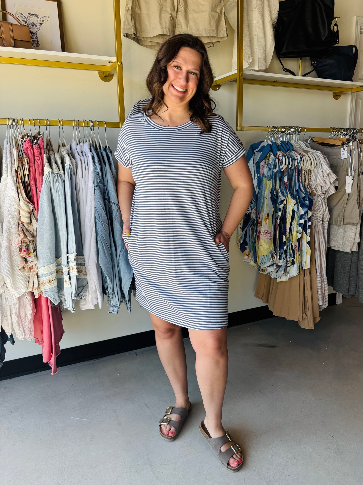 Staccato

Experience effortless style with this timeless navy striped t-shirt dress, featuring functional side pockets for your daily essentials. Crafted for ultimate comfort and versatility, it’s the perfect "throw-on-and-go" piece for busy mornings and relaxed weekends.

Functional side pockets for essentials.
Ultra-soft fabric for all-day comfort.
Classic, timeless navy nautical stripes.
Flattering, relaxed "everywhere" fit.
Effortless style for any occasion.
Easy-care, machine-washable material.