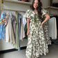 Entro

This Olive Floral Midi Dress combines elegance and comfort with its short bubble sleeves and flattering elasticated waist at the back. Crafted from lightweight woven fabric, it features a delicate floral print and a contrasting bow accent at the front for a refined touch. Fully lined and non-sheer, it offers modest coverage while side pockets add practical convenience. Ideal for stylish, effortless wear throughout the day.