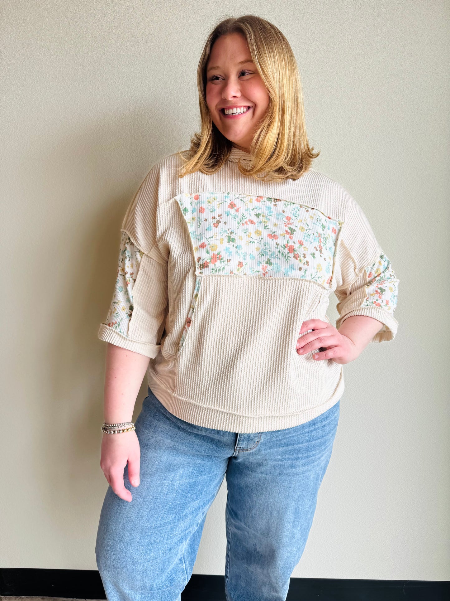 Oatmeal Half Sleeve Patchwork Hoodie Effortless layering meets artistic style with this lightweight half sleeve hoodie. Crafted with exposed hems that add contemporary edge, it features delicate floral accents that elevate everyday wear. Perfect for transitional seasons, the relaxed fit and breathable fabric make it ideal for casual outings or cozy evenings. A versatile piece that pairs seamlessly with your favorite basics.