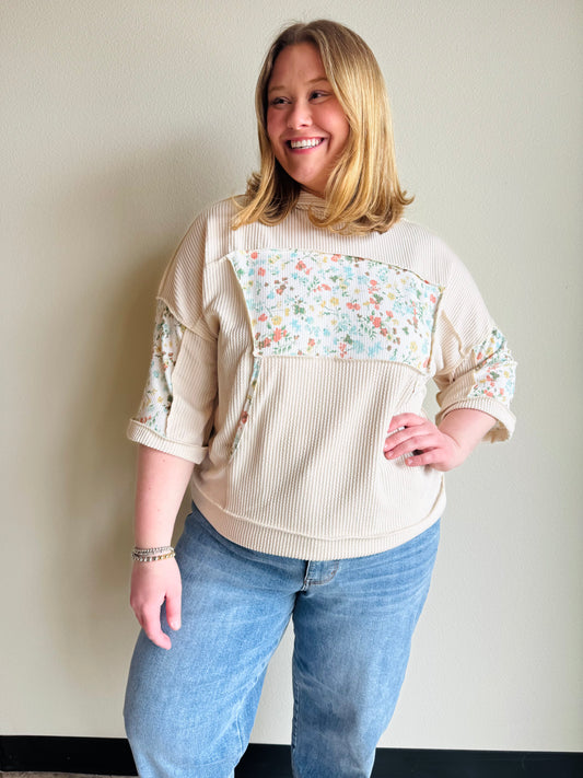 Oatmeal Half Sleeve Patchwork Hoodie Effortless layering meets artistic style with this lightweight half sleeve hoodie. Crafted with exposed hems that add contemporary edge, it features delicate floral accents that elevate everyday wear. Perfect for transitional seasons, the relaxed fit and breathable fabric make it ideal for casual outings or cozy evenings. A versatile piece that pairs seamlessly with your favorite basics.