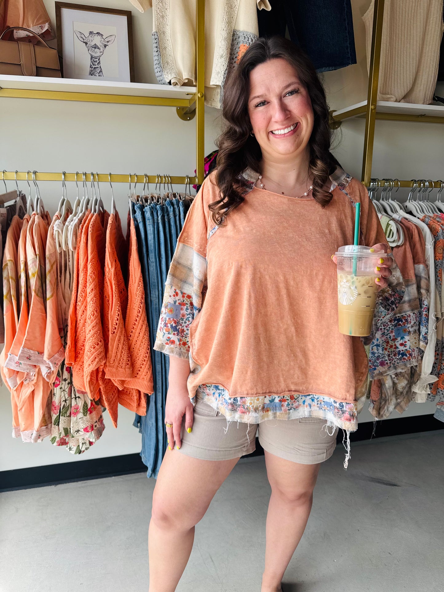 Oli &amp; Hali

Radiate confidence in this stunning midnight black midi featuring a high-contrast, vibrant floral print and a figure-flattering smocked bodice. The romantic puff sleeves and breezy tiered skirt create an effortless silhouette perfect for garden parties or sun-drenched brunches. Make a bold, feminine statement with this must-have summer staple

• Flattering smocked bodice hugs your curves.
• Romantic puff sleeves add vintage charm.
• Breezy tiered skirt for effortless movement.
• Bold vibrant