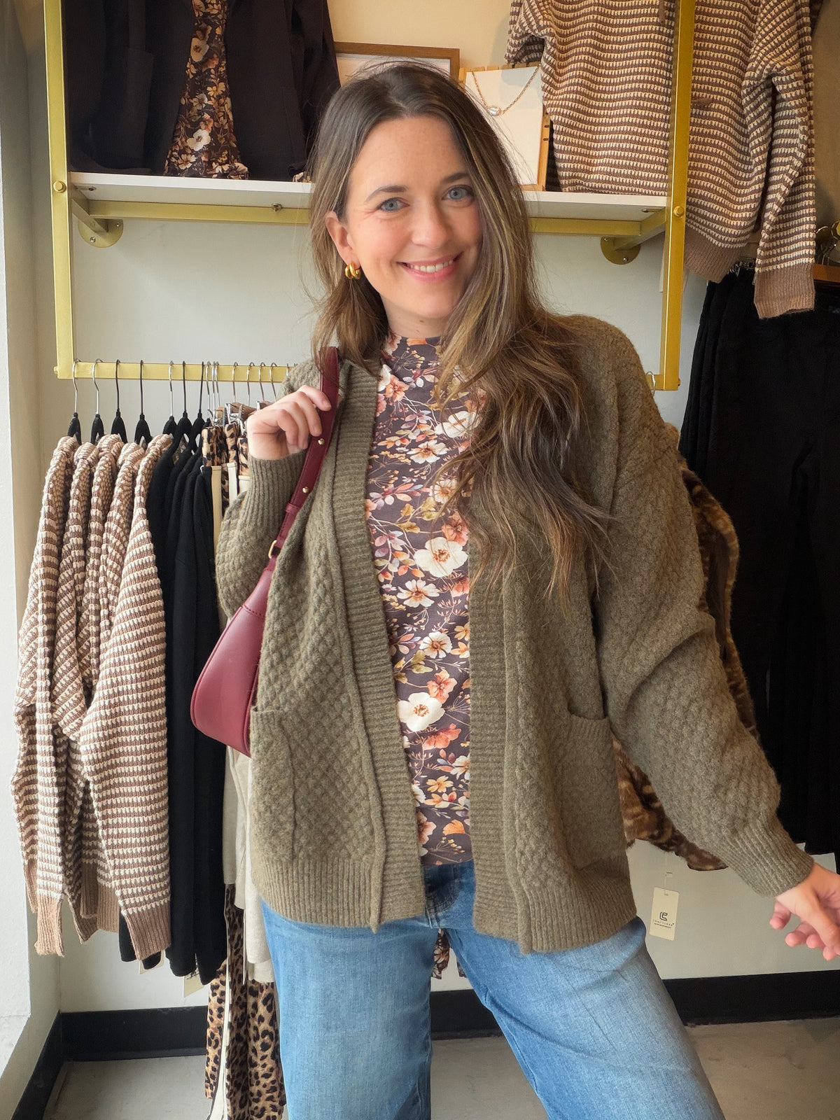 Meet the layer that makes a simple outfit feel pulled together. The Olive Honeycomb Textured Cardigan by Staccato pairs a rich olive shade with a dimensional honeycomb texture for a look that’s easy to mix into your everyday wardrobe. An open front keeps styling simple, while long sleeves and pockets bring those practical details we love.

Slip it over a tee and jeans for a coffee run, keep it handy for a cool afternoon, or layer it over a simple dress when your plans call for something a little more polish