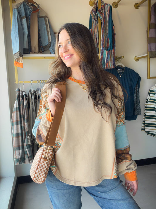 A effortlessly cool mix of pattern and texture, this lightweight terry top from Hem &amp; Thread is the kind of piece you reach for again and again. Paisley and checker prints come together in a playful colorblock that feels fresh and intentional — dressed up with white denim or down with your favorite joggers.

Lightweight terry fabric — breathable and easy to wear all day
Paisley &amp; checker mixed print for a bold, editorial look
Relaxed silhouette that flatters every frame
Available in Small, Medium, a