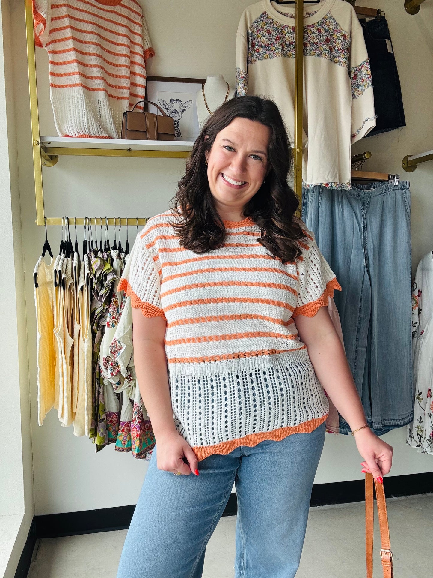 Haptics

Elevate your sunshine style with this airy, netted crochet sweater top featuring vibrant orange stripes and feminine flutter sleeves. This lightweight, scalloped-hem beauty offers the perfect blend of boho charm and breathable comfort for effortless daytime layering.

Airy netted knit for summer comfort.
Playful scalloped hem adds feminine flair.
Flutter sleeves for a relaxed silhouette.
Bold orange stripes pop against cream.
Perfect for layering over camis.
Soft, lightweight crochet sweater knit.

