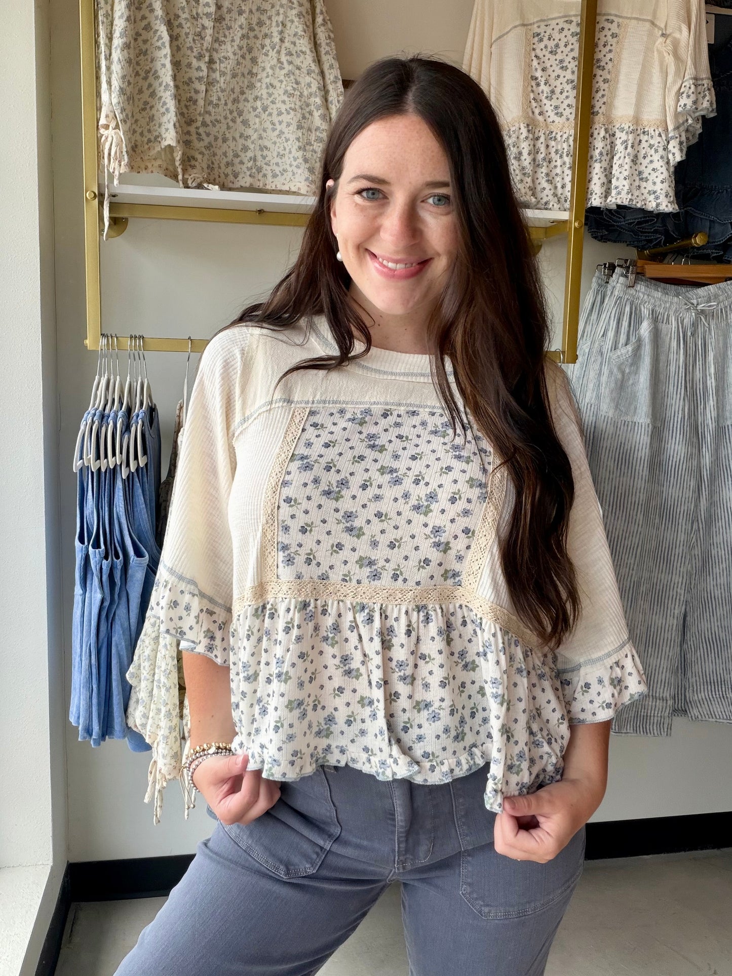 Pretty meets polished. The Dainty Floral Peplum Ribbed Top is the kind of top that does all the work for you — feminine floral detail, a figure-flattering peplum hem, and a cozy ribbed knit that hugs in all the right places.

Long sleeves make it a natural transition piece you can reach for well beyond summer, while the peplum silhouette adds just enough shape and movement to keep things interesting. Dress it up with tailored trousers or keep it casual with your go-to jeans — either way, it's an easy yes.
