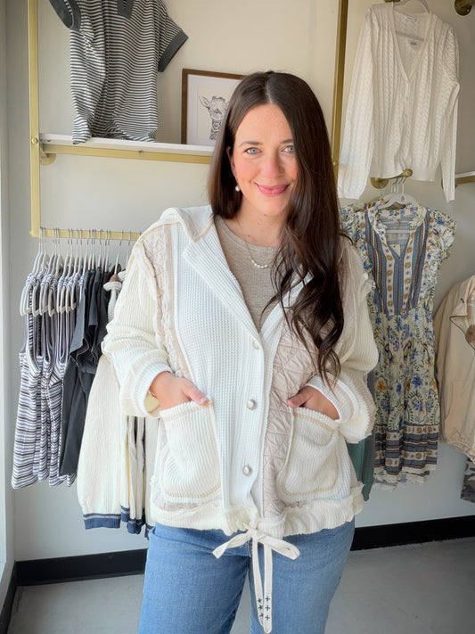 The ultimate cozy-chic layer. The Cream Quilted Thermal Button Up by POL is a wardrobe staple that blurs the line between jacket and sweater — in the best possible way. Featuring a button-down front, oversized fit, and a quilted thermal knit construction with cut-and-sew sweater knit panels, this piece delivers serious texture and warmth without sacrificing style.

The hoodie detail adds a casual, laid-back vibe that pairs effortlessly with denim, leggings, or your favorite wide-leg trousers. Wear it open a