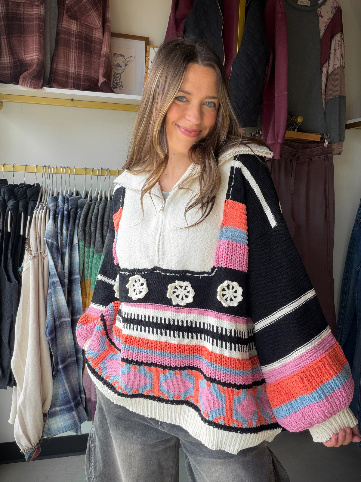 POL

Designed in half zip up, balloon sleeve, roomy fit top in chenille sweater with outseam edge and patch detail pointed striped pattern.