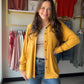 Cozy meets chic. The Mustard Butter Soft Button Up lives up to its name — the Rayon/Acrylic/Spandex blend is incredibly soft and drapes beautifully, making it one of those tops you'll want to live in. The warm mustard hue is a fall-ready neutral that pairs effortlessly with denim, trousers, or layered under a vest.

Long sleeve button-front silhouette
Two front bust pockets
Butter-soft fabric with a relaxed drape
75% Rayon / 15% Acrylic / 10% Spandex
Warm mustard colorway — a versatile seasonal staple