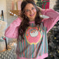 Bring a playful pop of pink to your holiday wardrobe with the Jolly Santa Pink Crewneck by Panache. This festive sweatshirt is a sweet alternative to traditional Christmas colors, ready for tree-trimming afternoons, holiday shopping trips, and those just-one-more-Christmas-movie evenings.

The polyester, cotton, and spandex blend brings a touch of stretch to your seasonal lineup. Pair it with your favorite denim for a casual holiday outing, or style it with leggings and sneakers for a laid-back December day