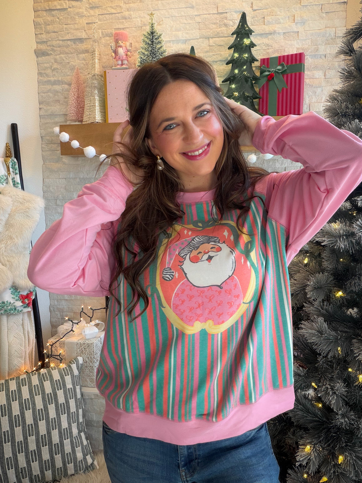 Bring a playful pop of pink to your holiday wardrobe with the Jolly Santa Pink Crewneck by Panache. This festive sweatshirt is a sweet alternative to traditional Christmas colors, ready for tree-trimming afternoons, holiday shopping trips, and those just-one-more-Christmas-movie evenings.

The polyester, cotton, and spandex blend brings a touch of stretch to your seasonal lineup. Pair it with your favorite denim for a casual holiday outing, or style it with leggings and sneakers for a laid-back December day