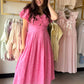 Sweet, summery, and utterly feminine — the Pink Crochet Puff Sleeve Dress by Gigio is the kind of dress that turns heads effortlessly. Crafted from 100% cotton, this eyelet midi dress features a beautifully textured crochet construction with a print twist bodice and elastic shoulders for a flattering, easy fit. Puff sleeves add a romantic, editorial touch, while the pleated midi skirt creates graceful movement with every step. Fully lined for a polished finish.

Details:

Eyelet crochet fabric throughout
Pr