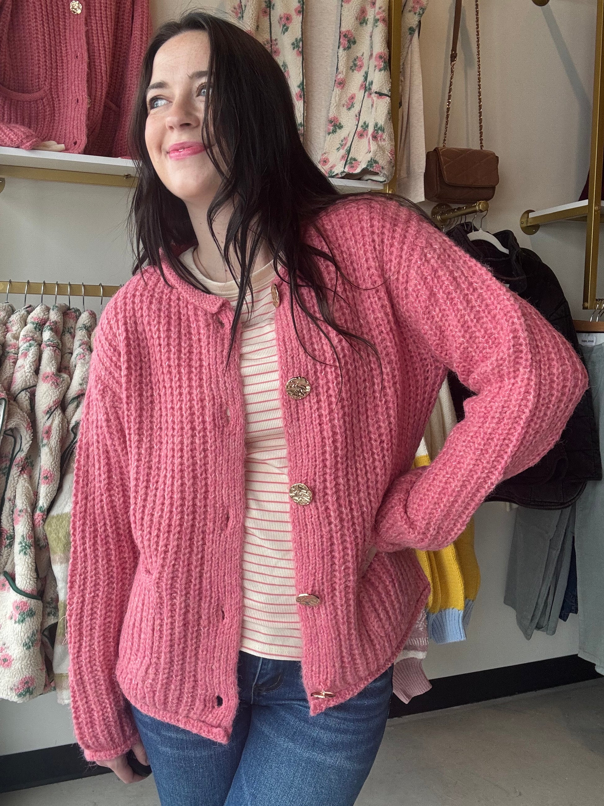 The Pink Hammered Metal Button Sweater is perfect for those chilly days. Made with soft, chunky material, it features a big metal button down front and cozy long sleeves. Store your essentials in the convenient patch pockets. Stay warm and stylish with this must-have cardigan.

Staccato&nbsp;