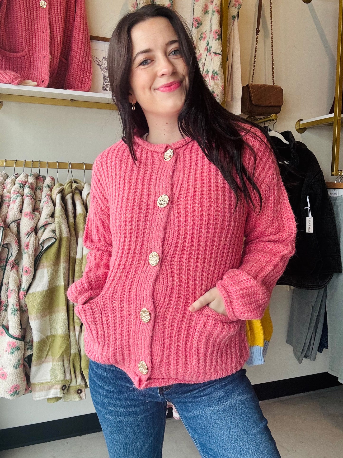 The Pink Hammered Metal Button Sweater is perfect for those chilly days. Made with soft, chunky material, it features a big metal button down front and cozy long sleeves. Store your essentials in the convenient patch pockets. Stay warm and stylish with this must-have cardigan.

Staccato&nbsp;