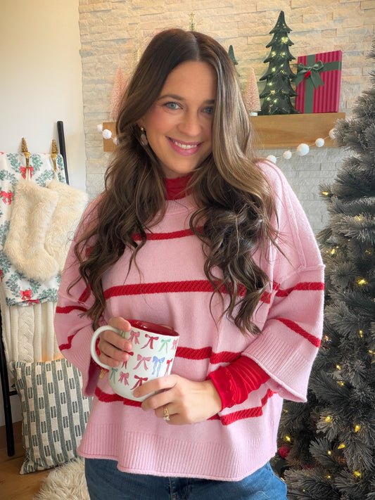 A Fresh Pop of Pink

The Pink Luxe Crew Sweater by Cotierra brings a playful touch to laid-back dressing with striped detail and an oversized, boxy silhouette. Lightweight yarn and dropped shoulders give it an easygoing feel, while open-knit stripe detail adds texture that makes even a simple jeans-and-sweater outfit feel thoughtfully styled.

Picture a slow morning coffee turning into an afternoon browsing your favorite shops. Pair this pullover with denim and sneakers for the day, then swap in ankle boots