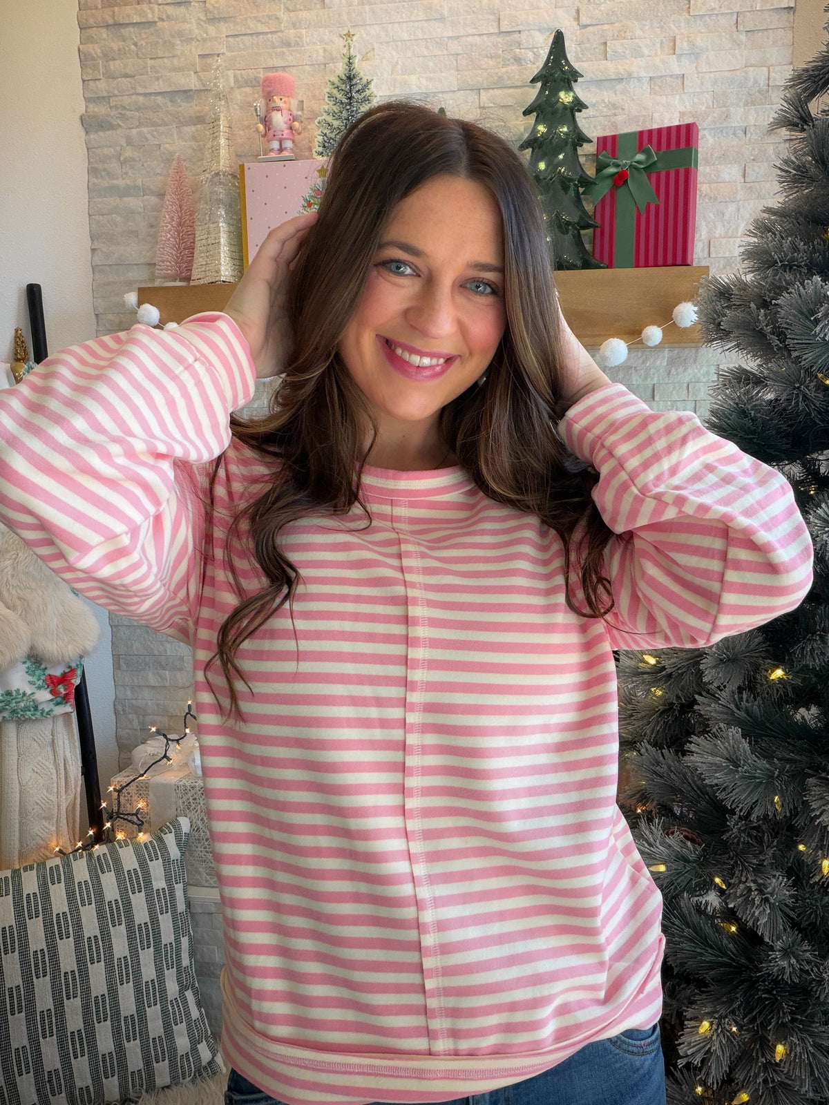 Bring a little color to your casual days with the Pink Striped Center Detail Sweatshirt by Staccato. Pink stripes and a center cut-edge detail give this everyday favorite a playful finish, while the micro-brushed fabric adds a soft touch you’ll look forward to slipping into.

With its loose fit, classic crew neckline, and long sleeves, it’s an easy choice for coffee runs, weekend browsing, or a relaxed afternoon with friends. Picture it with your favorite jeans and sneakers, ready for whatever the day bring