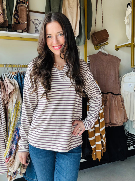Experience the perfect balance of comfort and warmth with the Plum Stripe V Neck Top. Crafted from a super soft, heavy-weight fabric, this top offers a cozy feel that sits comfortably between a long sleeve shirt and a sweatshirt. Its refined texture and weight make it ideal for layering or wearing alone in cooler weather, providing both style and functionality.

Staccato