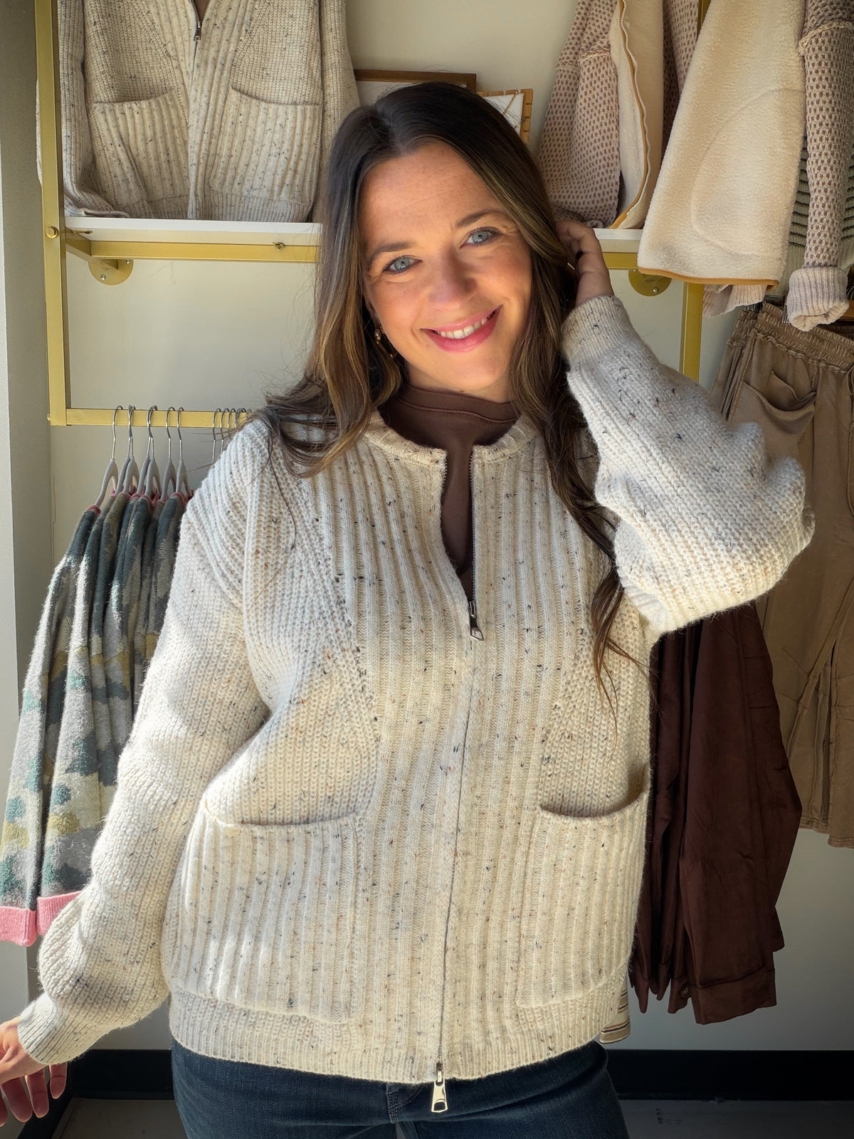 POL

Textured rib-knit zip cardigan featuring soft speckled yarn detailing throughout for a cozy, vintage-inspired look. Designed with a mock neckline, two-way zip-front closure, and a subtly fitted silhouette that flatters the figure. Finished with ribbed patch pockets, long sleeves, and a midweight knit fabrication for warmth, comfort, and effortless everyday layering.
--------------------------------------------------------------------------
Fabric Contents:
-&nbsp;46%POLYESTER 21%ACRYLIC 28%NYLON 5%WOOL
