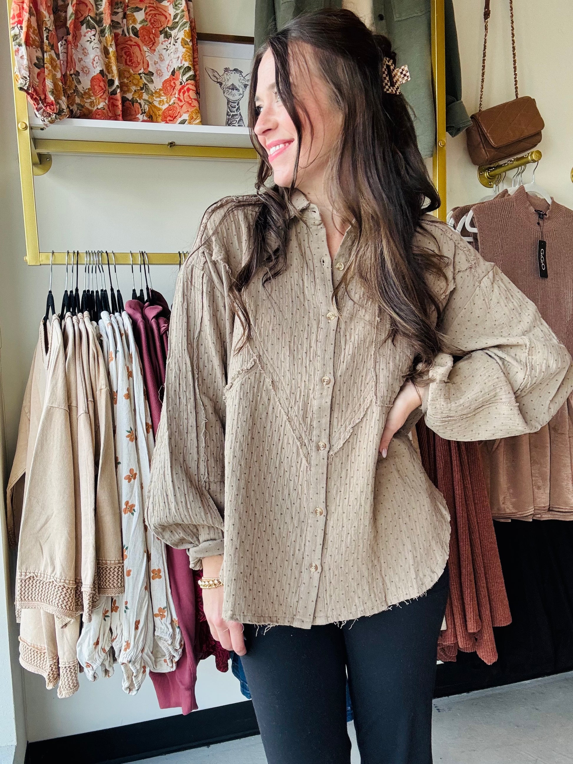 This Olive Grey Gauze Button Up features a lightweight cotton gauze fabric with a relaxed, boxy silhouette for breathable comfort. Designed with dropped shoulders, a collared neckline, and a button-down closure, it offers easy layering and effortless style. The shirt includes raw cut, frayed seams, button cuffs, and a front chest pocket for subtle detailing. Mini polka dot prints add refined texture, while the rounded hem enhances its modern, loose fit—perfect for a casual yet polished look.

Easel