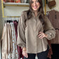 This Olive Grey Gauze Button Up features a lightweight cotton gauze fabric with a relaxed, boxy silhouette for breathable comfort. Designed with dropped shoulders, a collared neckline, and a button-down closure, it offers easy layering and effortless style. The shirt includes raw cut, frayed seams, button cuffs, and a front chest pocket for subtle detailing. Mini polka dot prints add refined texture, while the rounded hem enhances its modern, loose fit—perfect for a casual yet polished look.

Easel