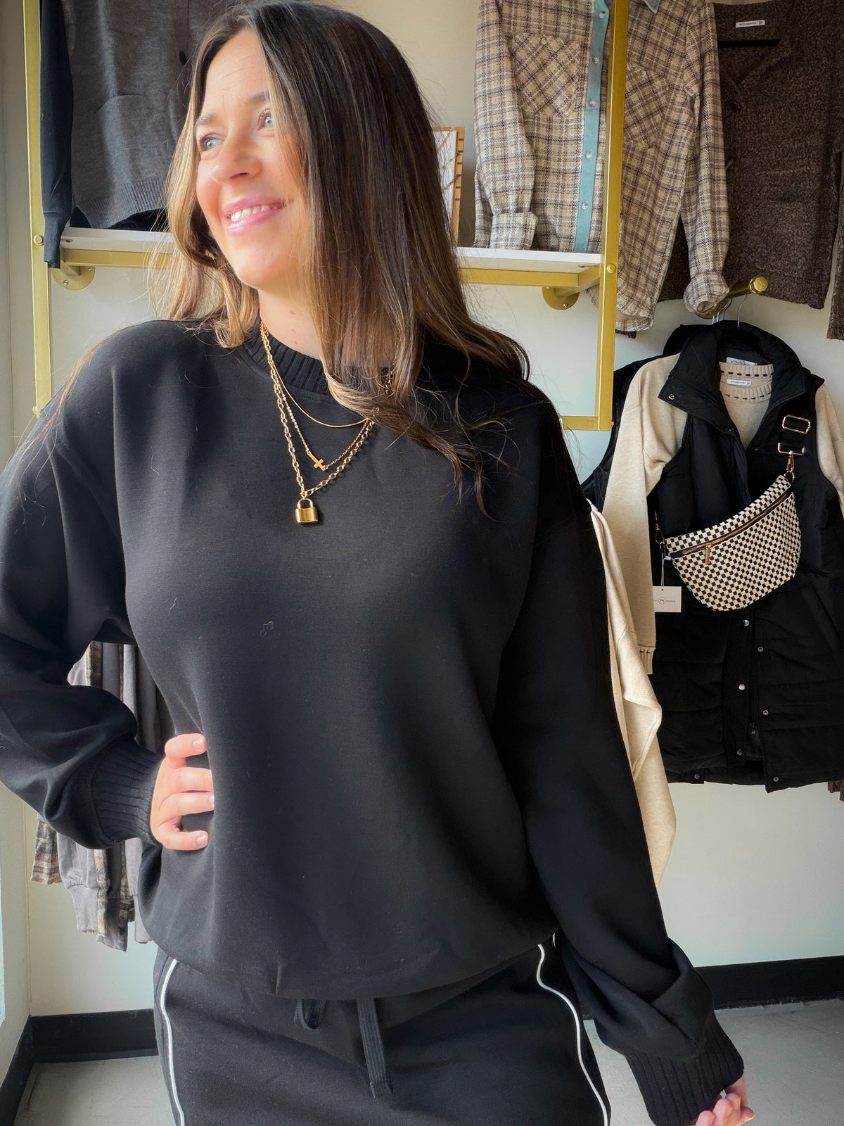 The kind of black pullover you'll want close at hand when the day calls for easy dressing. This Rae Mode crewneck brings a clean, versatile look to coffee runs, casual plans and quiet afternoons. Wear it with denim for an effortless outfit or pair it with your favorite relaxed bottoms.

Details to love

Classic black crewneck style
Pullover sweatshirt silhouette
Available in Small, Medium and Large
Fabric

48% modal, 45% polyester, 7% spandex. Rae Mode style T0123.