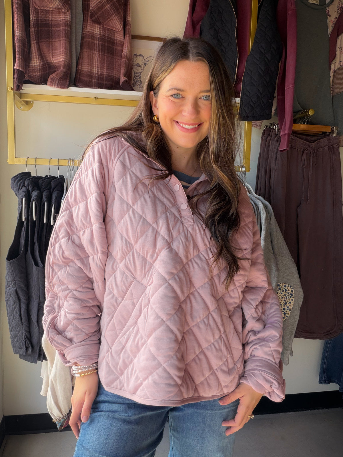 A little texture makes a casual day feel more considered. The Mauve Quilted Snap Pullover by Rae Mode gives you that easy throw-on layer with a quilted look and snap detail, all in a soft mauve tone that plays beautifully with denim and neutrals. Grab it for a coffee run, a relaxed afternoon, or the kind of day that calls for one more layer.

Details you'll love

Quilted look with snap accents.
Mauve color for an easy-to-style pop of softness.
Designed in the USA by Rae Mode.
Fabric: 78% polyester, 18% cott