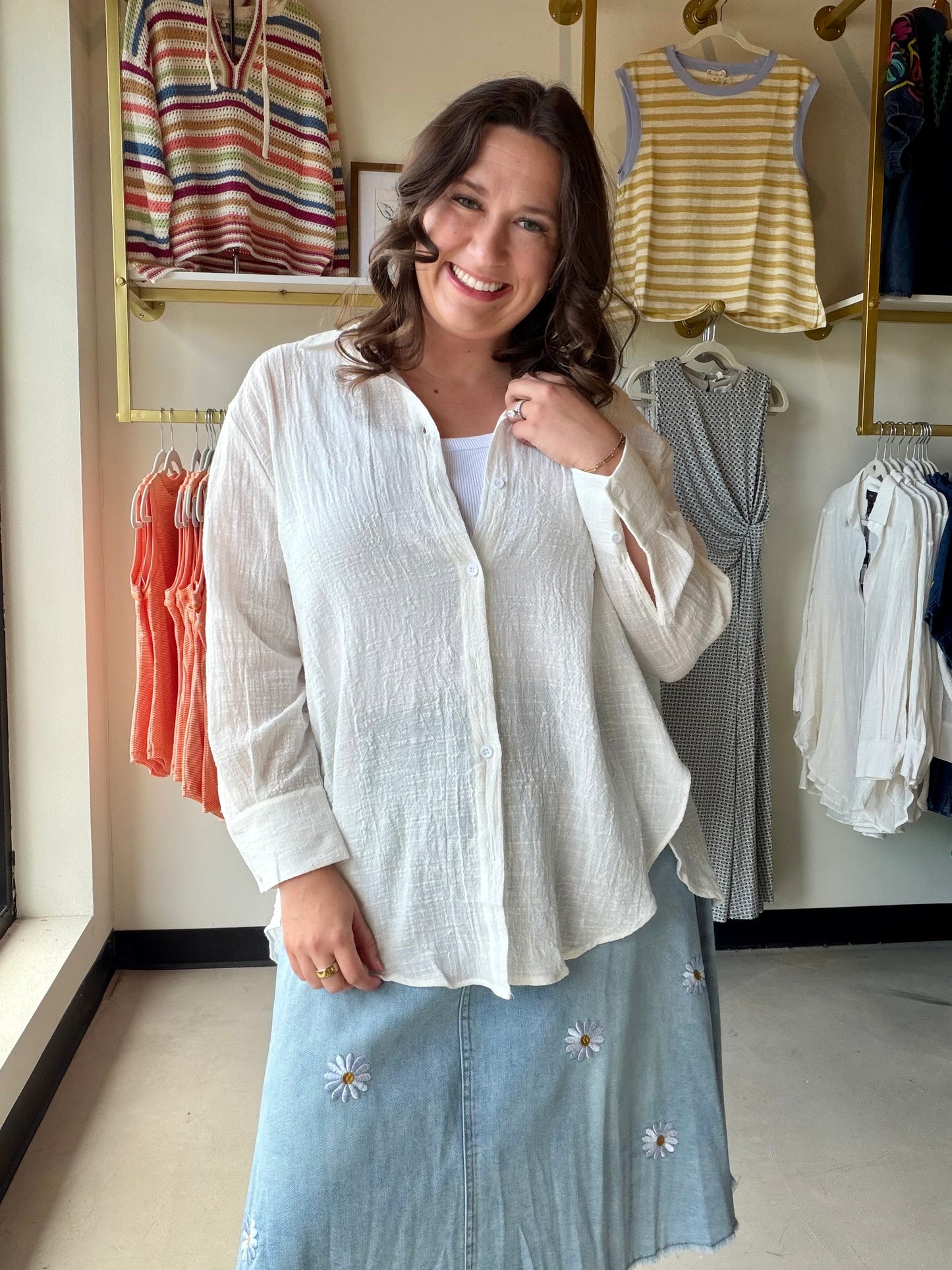 Effortlessly polished, endlessly versatile. The White Gauze Button Up (Aurelia Wrap Shirt) by Rain + Rose is a lightweight 100% rayon top that strikes the perfect balance between structured and relaxed. A crisp collar, long sleeves, and exaggerated cuffs give it a refined feel, while the wrap-tie front keeps things feminine and figure-flattering.

Wear it tucked into high-waisted denim, tied at the waist over a slip skirt, or left open as a breezy layer over a tank — this one does it all.

Crisp collar with