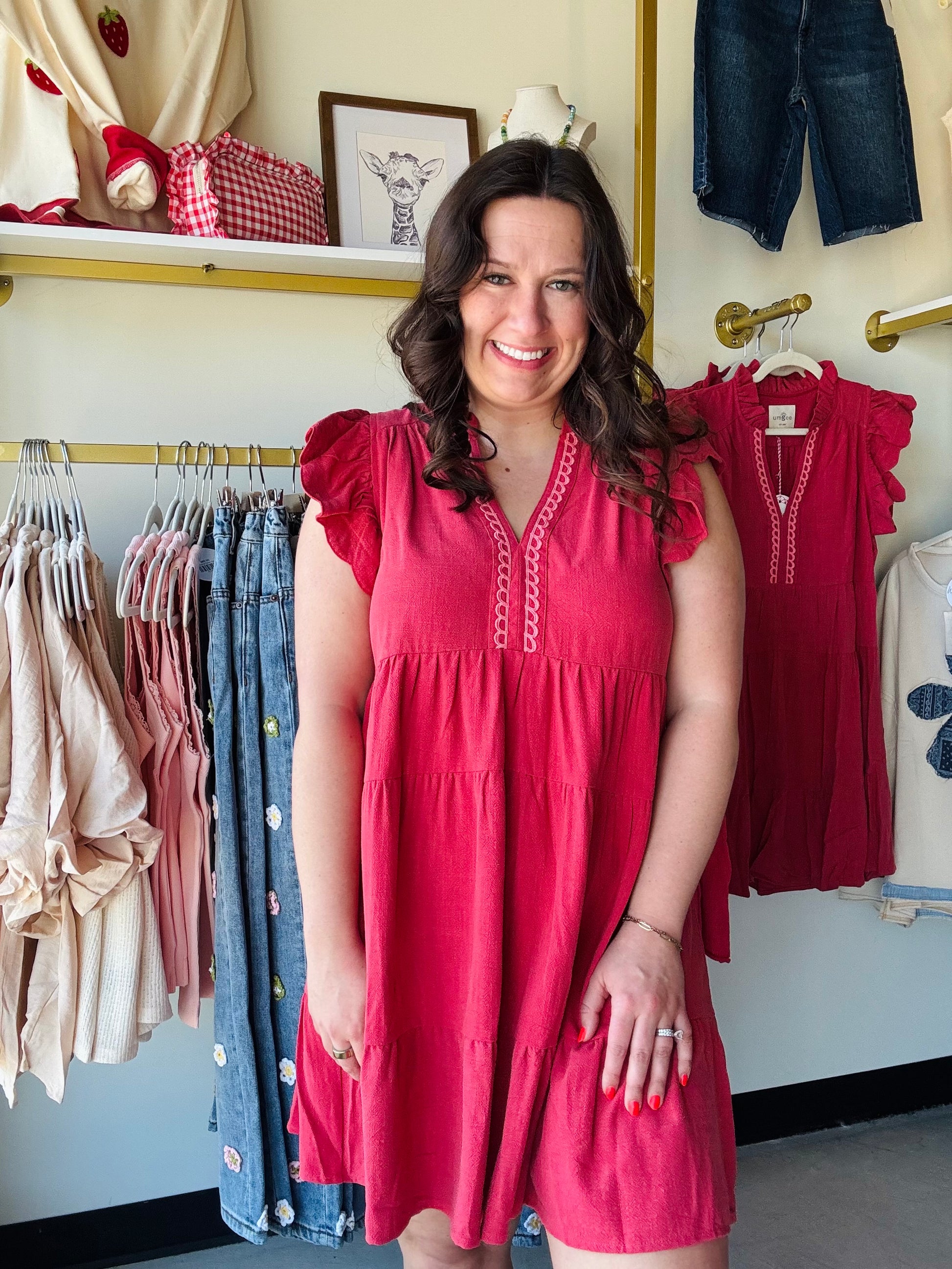 Umgee

Embrace effortless summer elegance in this vibrant raspberry linen-blend dress. Featuring feminine flutter sleeves and a breezy tiered silhouette, it offers the ultimate combination of style and breathable comfort. The delicate scalloped split V-neck adds a chic, artisanal touch to your sun-drenched wardrobe.

Cooling linen-cotton blend all-day comfort.
Flattering tiered silhouette moves beautifully.
Playful flutter sleeves add charm.
Elegant scalloped V-neck detail.
Vibrant raspberry hue turns heads