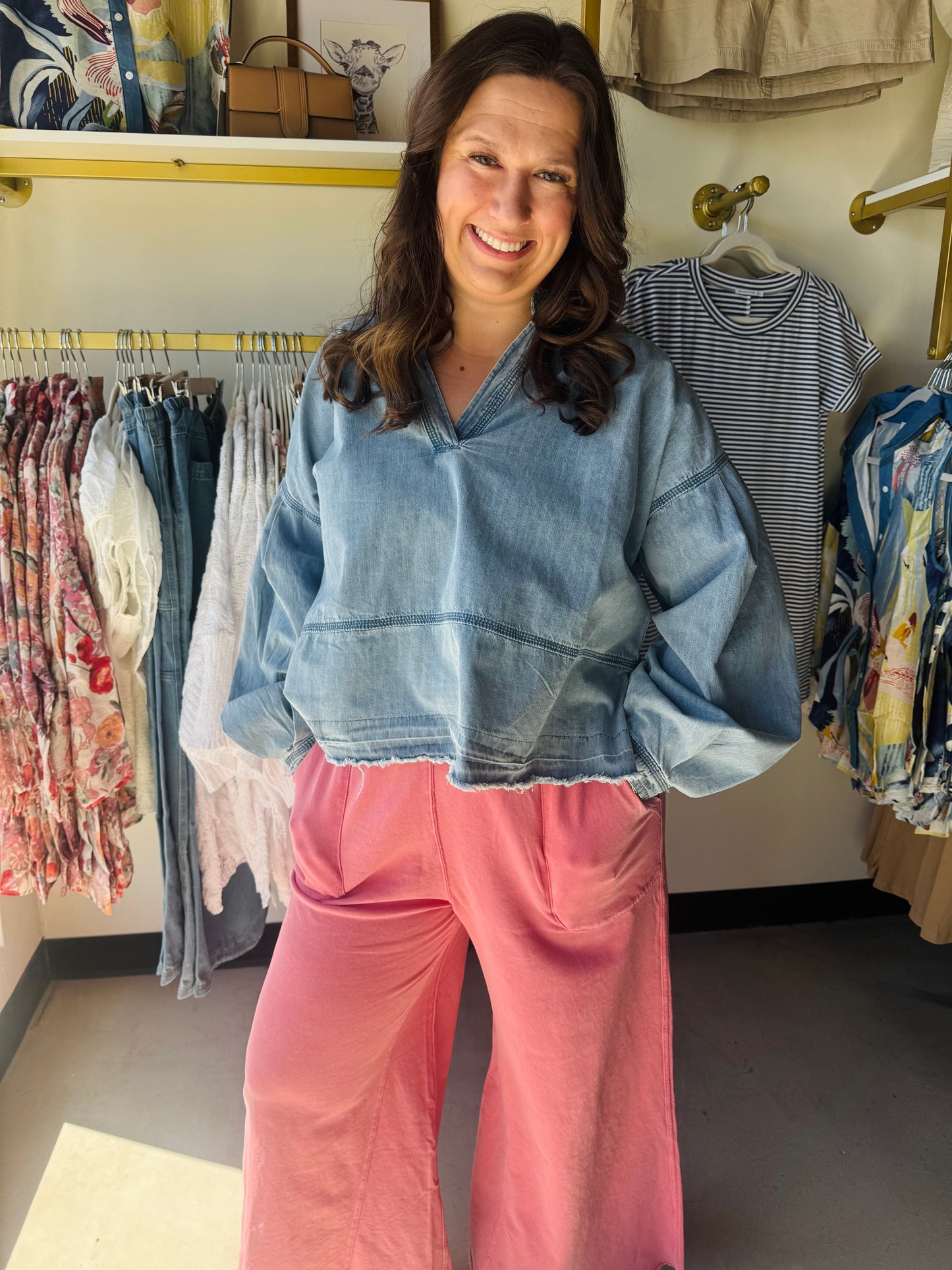 Wishlist

Elevate your everyday aesthetic with this ultra-soft Wishlist denim pullover, featuring dramatic balloon sleeves and a flattering V-neckline. The raw, exposed hem adds a modern, edgy finish to this effortless boho-chic essential. Perfect for transitions, it pairs seamlessly with your favorite flares, leggings, or knit pants for instant style.

Dramatic balloon sleeves&nbsp;for statement style.
Flattering V-neckline&nbsp;for effortless layering.
Edgy raw hem&nbsp;adds modern detail.
Premium soft-wa