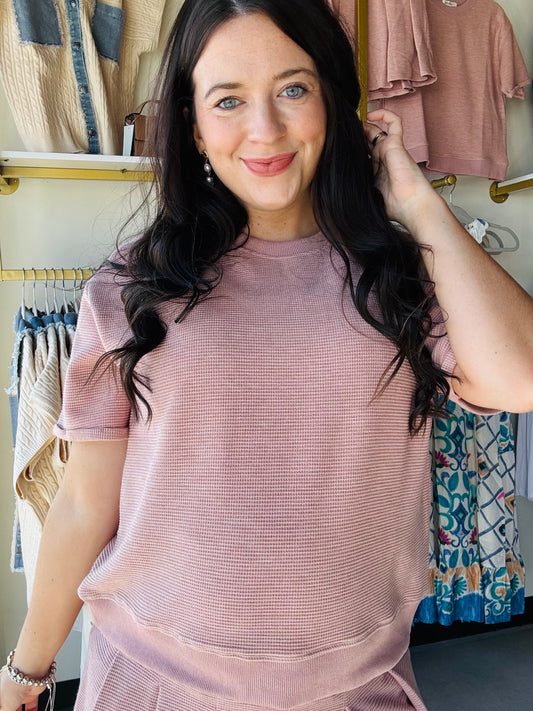 Wishlist

Elevate your casual wardrobe with this rose waffle knit pullover, designed for effortless style and comfort. The textured waffle knit fabric offers breathable wear perfect for layering or standalone looks. Pair it seamlessly with the matching skort for a coordinated, put-together ensemble that transitions from day to night. Soft, versatile, and flattering—a wardrobe essential that works as hard as you do.