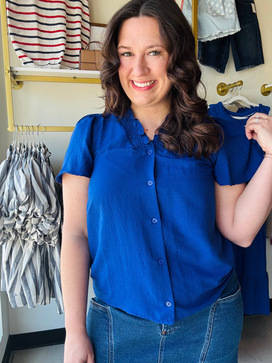 Elevate your everyday rotation with this vibrant royal blue blouse featuring feminine flutter sleeves and a sophisticated smocked neckline. Crafted from premium crinkle fabric, this functional button-up offers a breezy, effortless fit that transitions perfectly from the office to happy hour. It’s the ultimate combination of high-impact color and classic comfort.