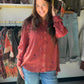 Tru Luxe Jeans

Rich dark rust and rich in detail, this button-up shirt is covered in tiny embroidered motifs that add texture and dimension to a timeless silhouette. Lightweight rayon gives it a soft hand and a graceful drape.

A classic collar, full button front, and buttoned cuffs keep it polished, while the curved shirttail hem makes it easy to wear untucked. It looks just as good over leggings as it does with dark denim and ankle boots.

Style #: T46225BM
Fabric Content: 100% Rayon
Length: 28.5" front 